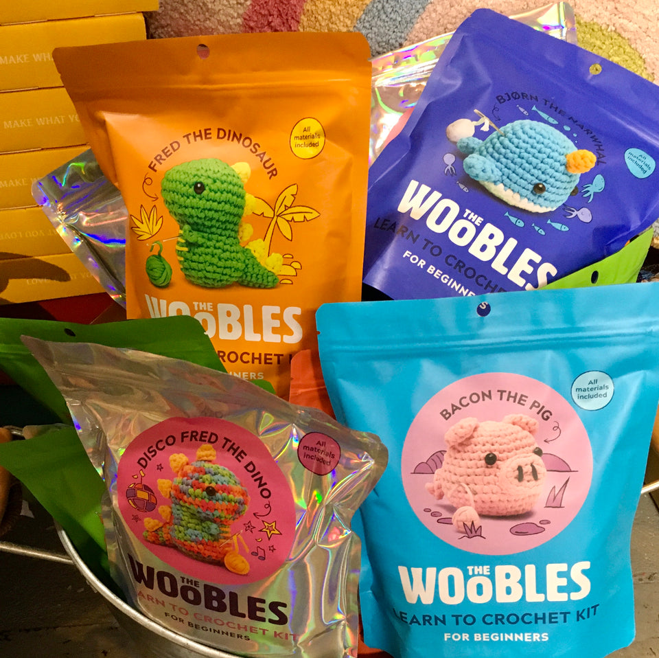 Shows a verity of kits in packages in a metal bucket