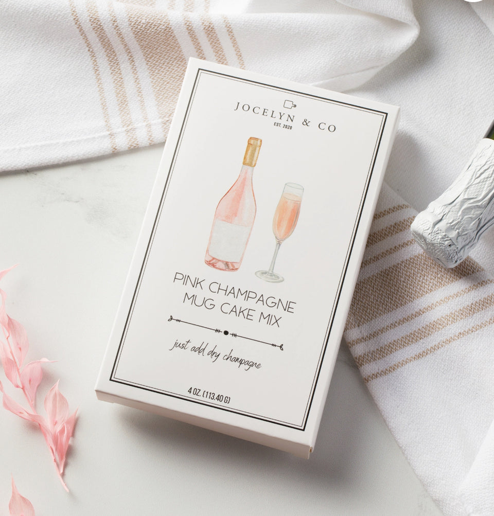 Box of pink champagne cake in a mug