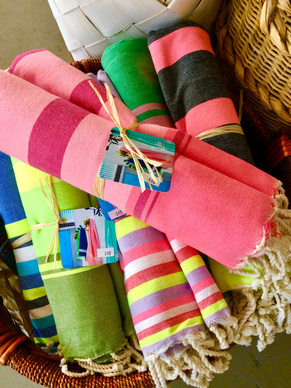 Brightly colored Turkish towels rolled up