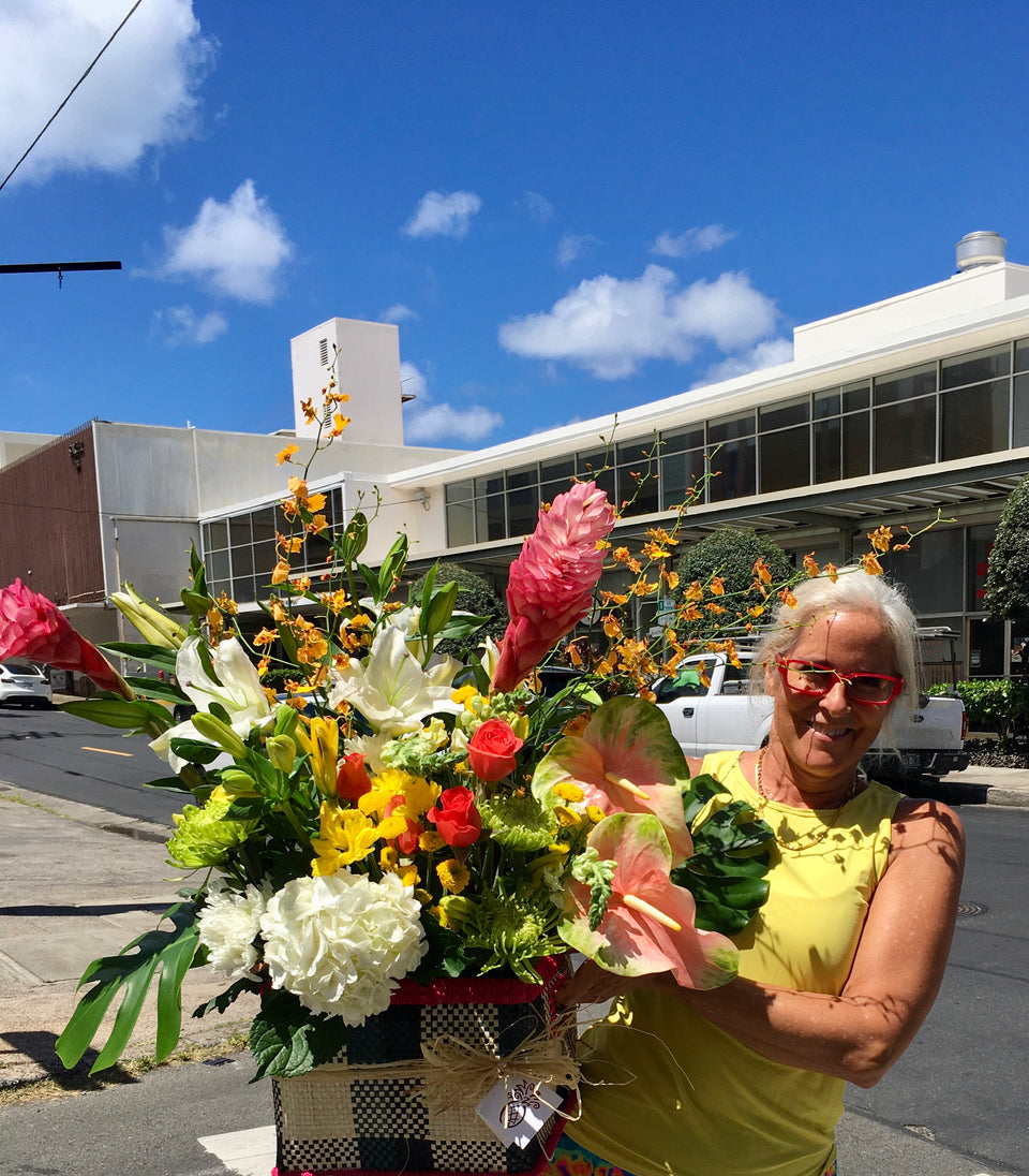 nalani delivering one of our hawaiian flower basket
