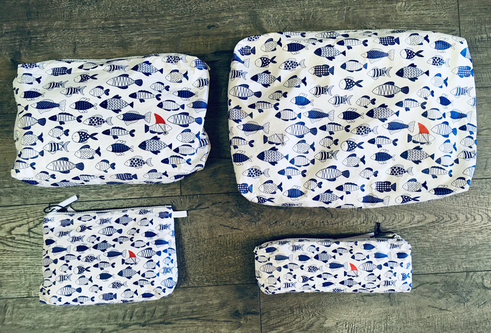 various shapes of pouches with blue fish