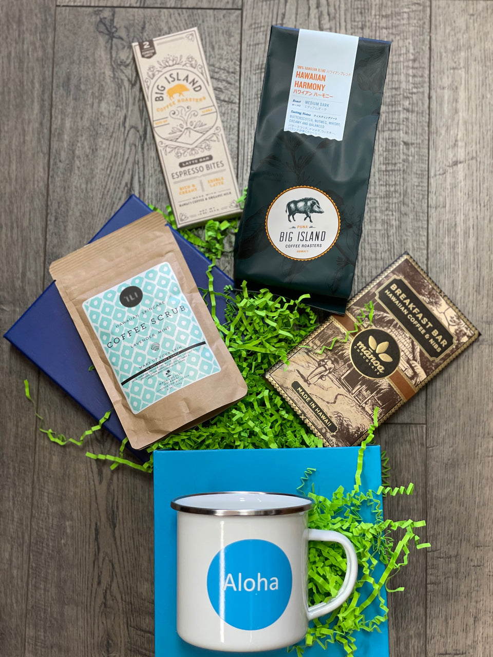 box displayed with a bag of coffee, coffee bar, chocolate bar coffee scrub and coffee mug