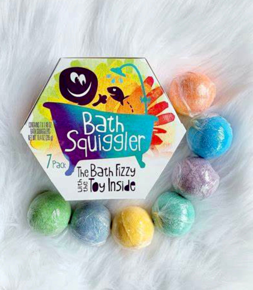 bath squiggler box with all the different color balms around it.