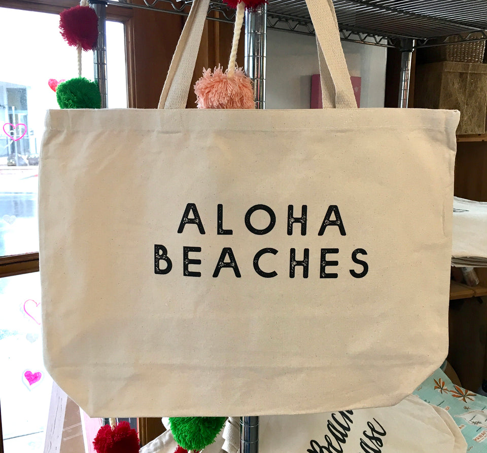 Large canvas tote with Aloha Beaches printed in black, middle of bag.