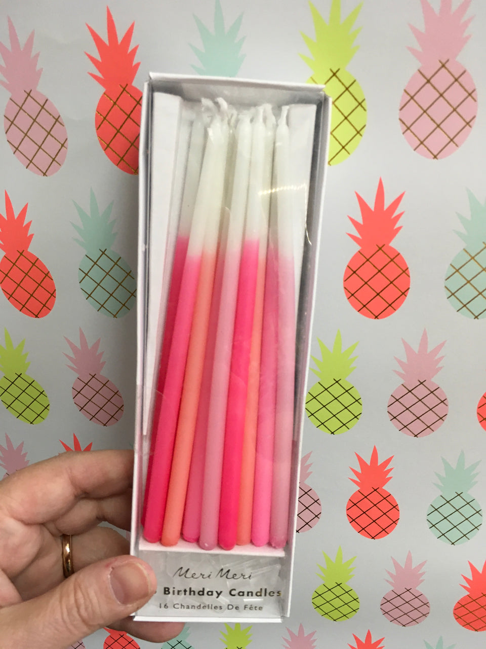 Box of various shades of pink extra long candles
