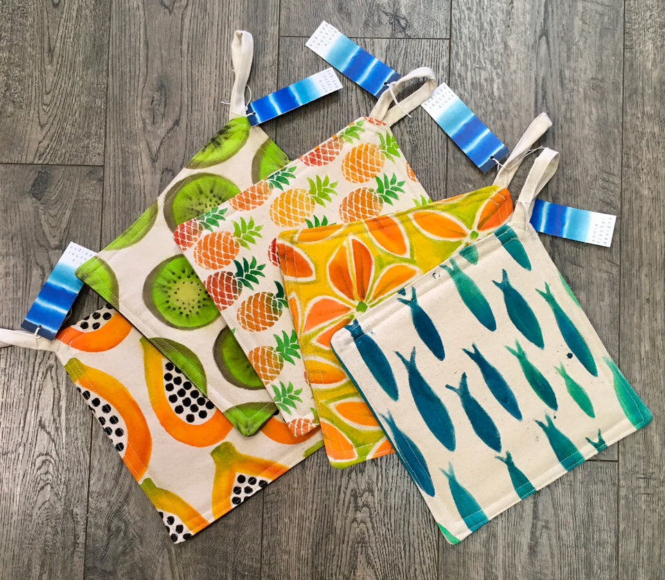 Mix of prints of colorful kitchen mitts