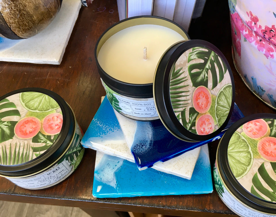 Guava sea salt candle. lid is open with two additional candles each side.