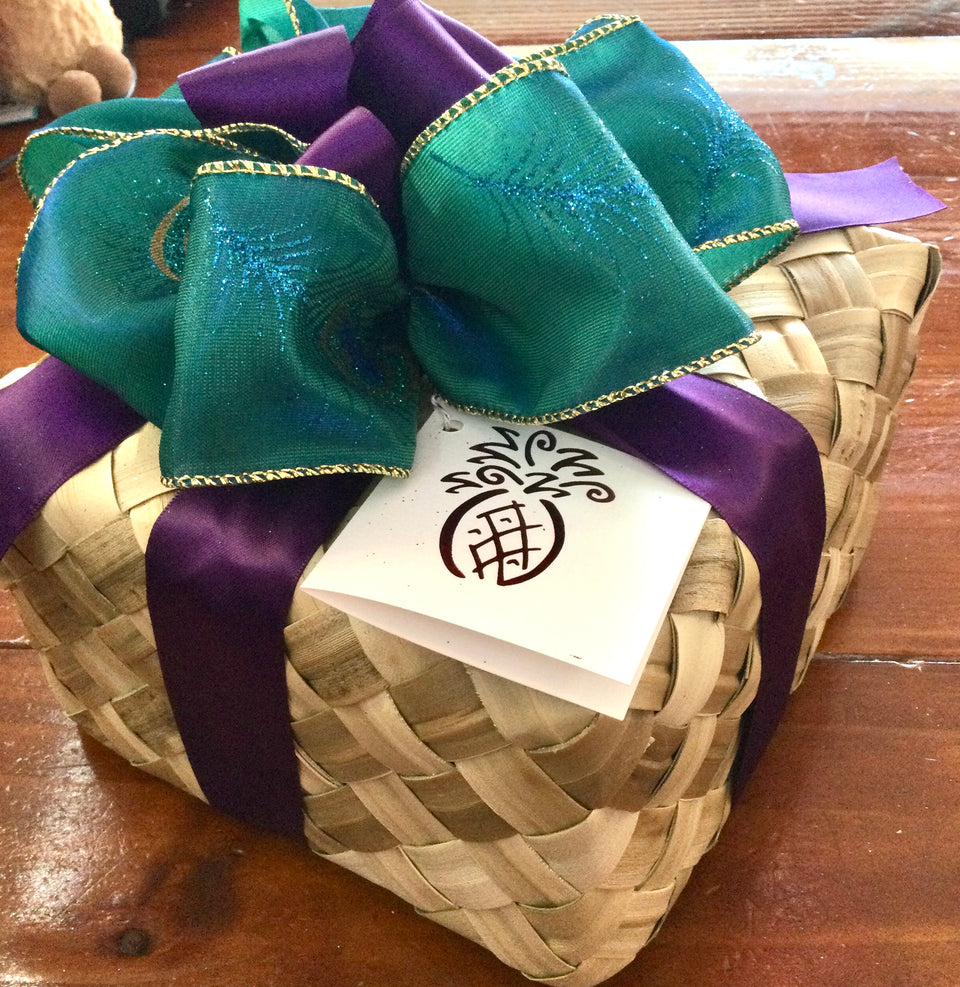 Example of a closed gift basket with lauhala and ribbon