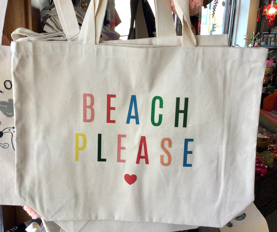 Canvas tote that says “Beach Please” in colorful block letters with a small heart below