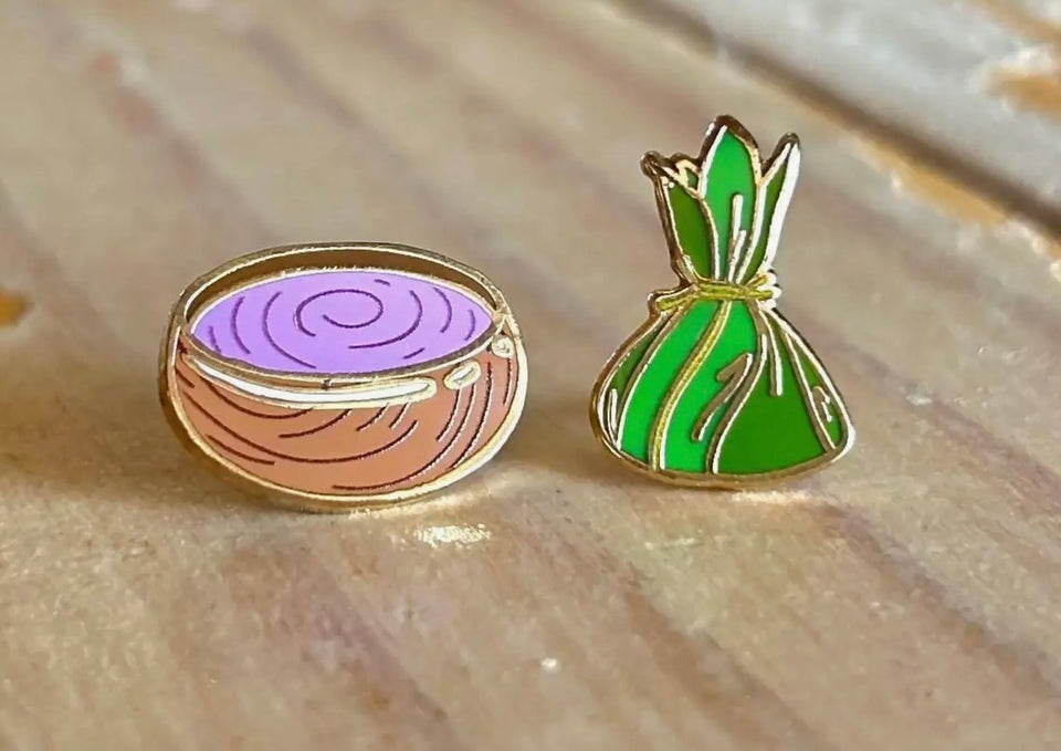 Enamel pins made by artist Mahea Leah