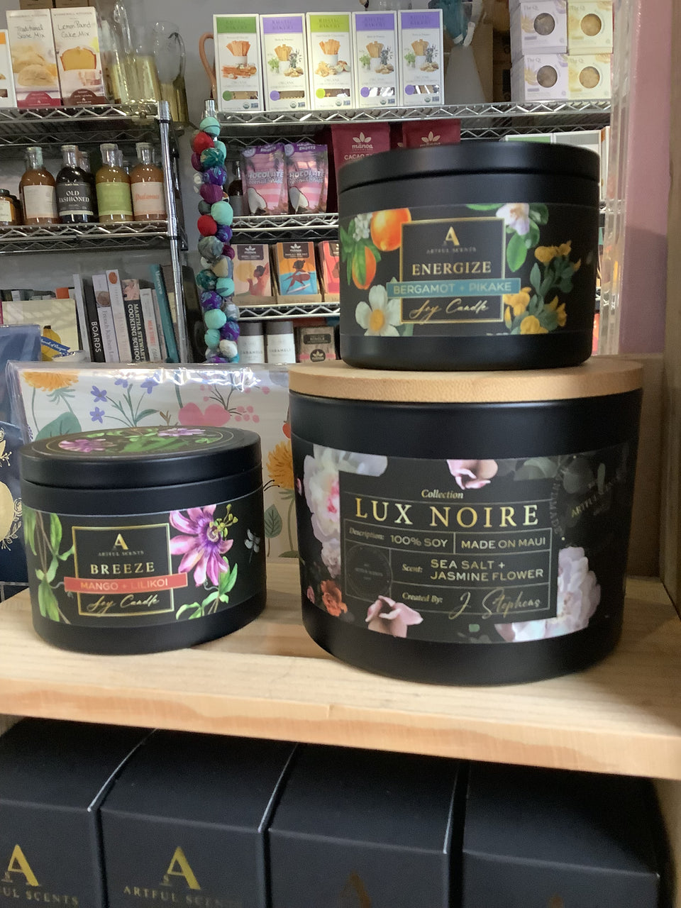 Showing the size of the 8 ounce candle compared to the lux noir candles 