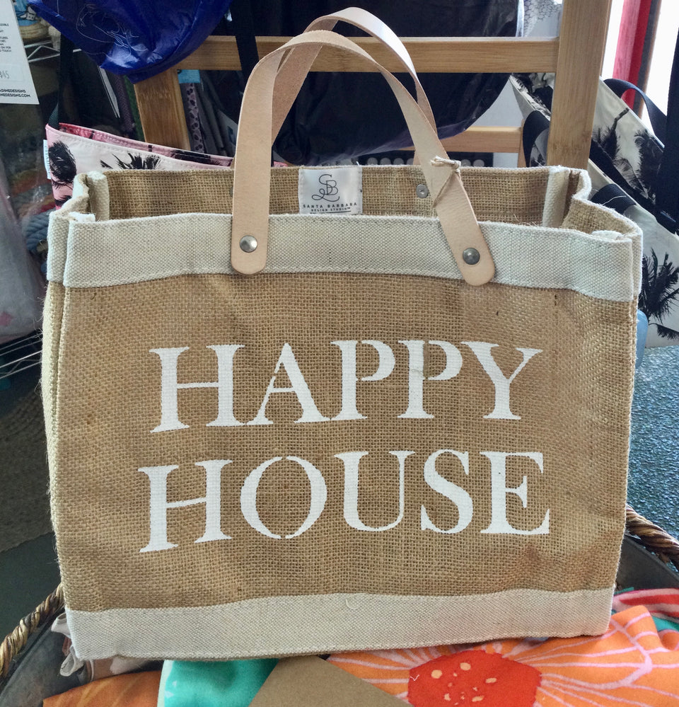 Jute tote with leather handles that saysHappy House in white letters