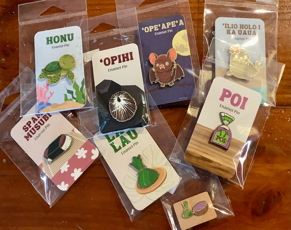 Enamel pins made by artist Mahea Leah