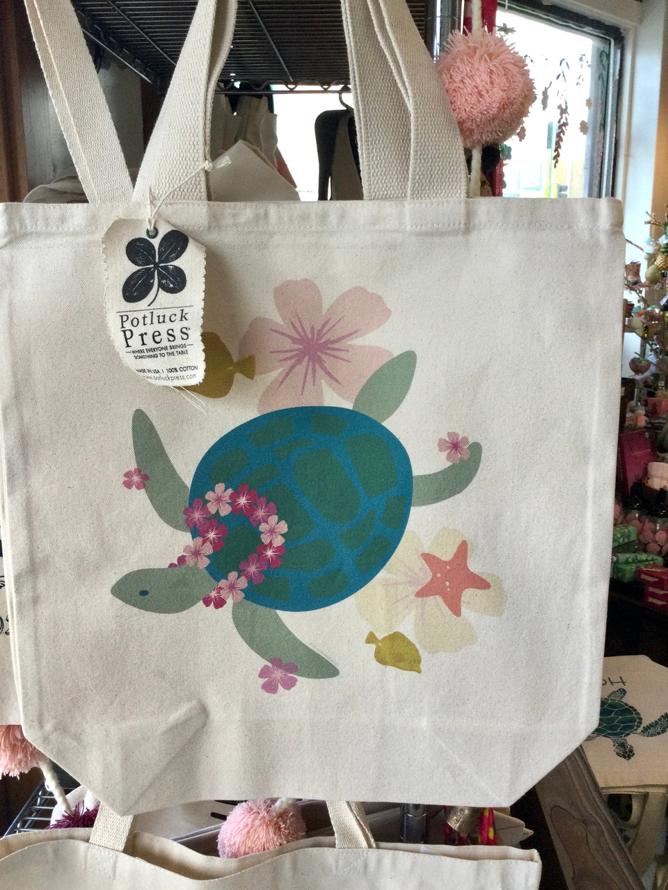 Cotton tote bag with swimming Honu wearing a lei and other flowers