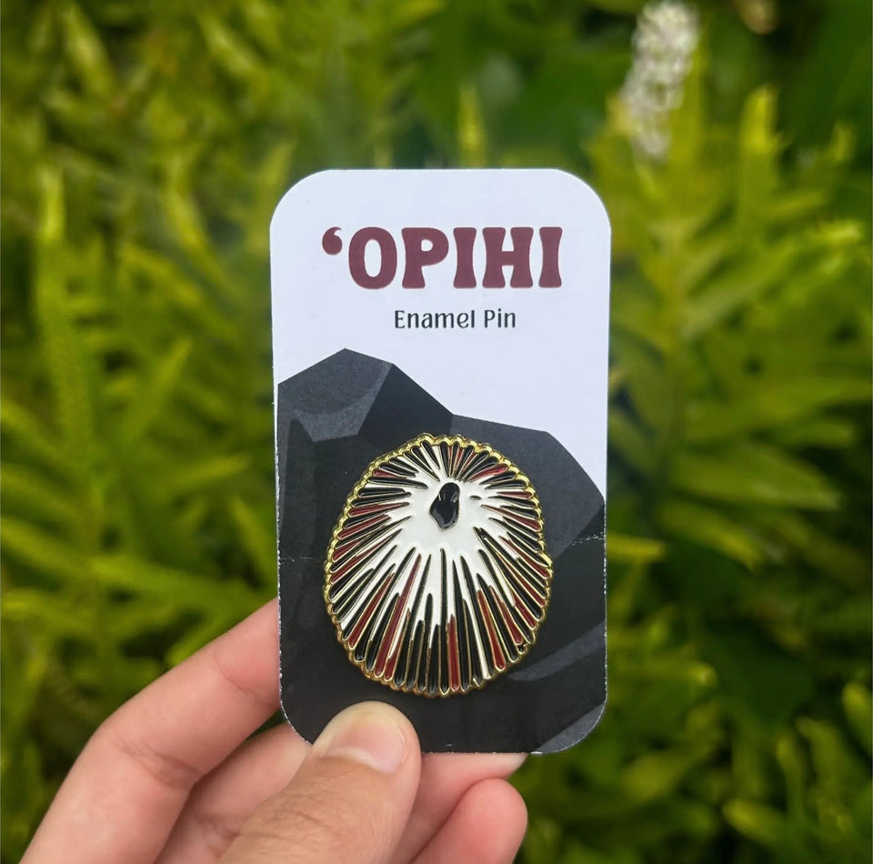Enamel pins made by artist Mahea Leah