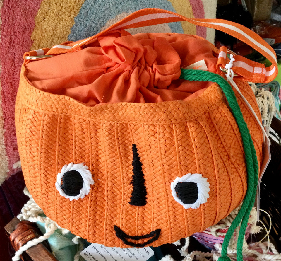 Orange pumpkin basket with drawstring closure and handle