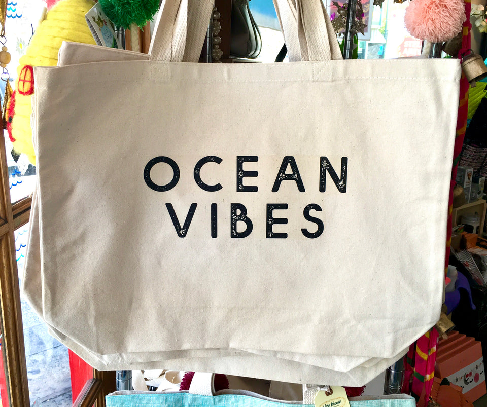 cotton canvas tote with black block letters the says Ocean Vibes