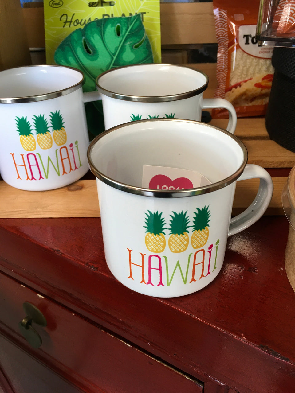 Hawaii pineapple mugs in a display