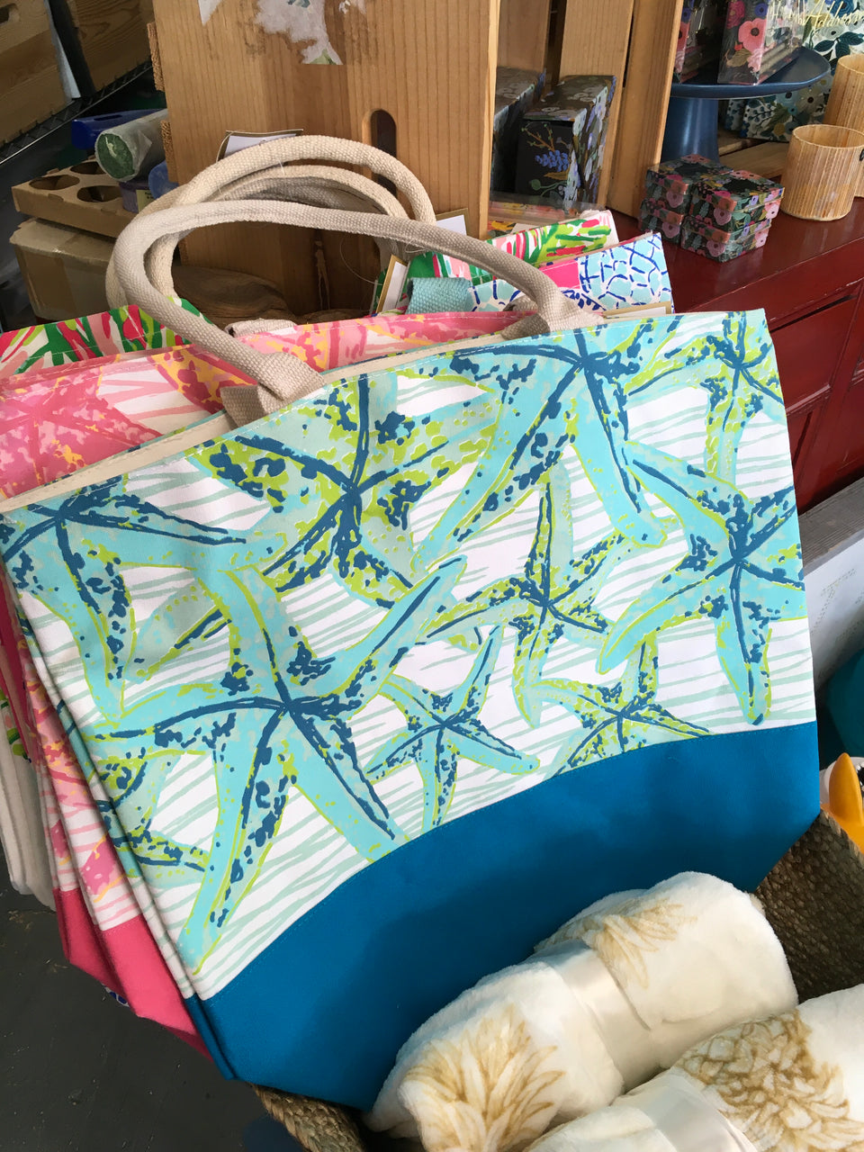 Starfish blue and green cotton tote bag in store