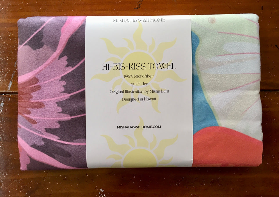 microfiber hibiscus towel folded up with label