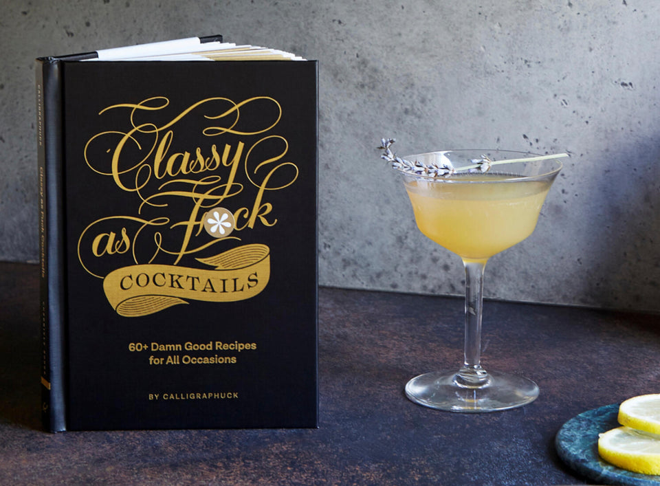 shows book along side a cocktail