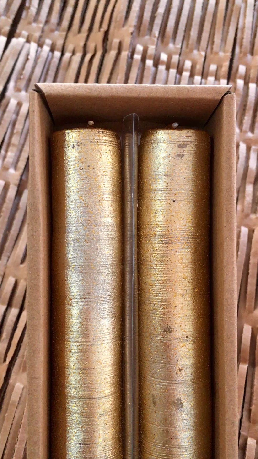 video showing glitter gold coating on candles