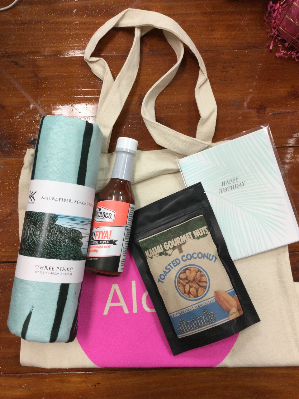 Tote bag with kean towel and hot sauce and nuts 