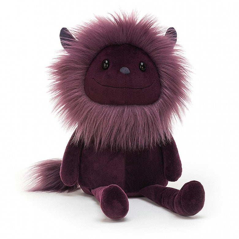 Plum colored stuffed monster with horns
