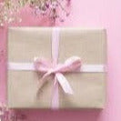 simple brown paper box with pink ribbon