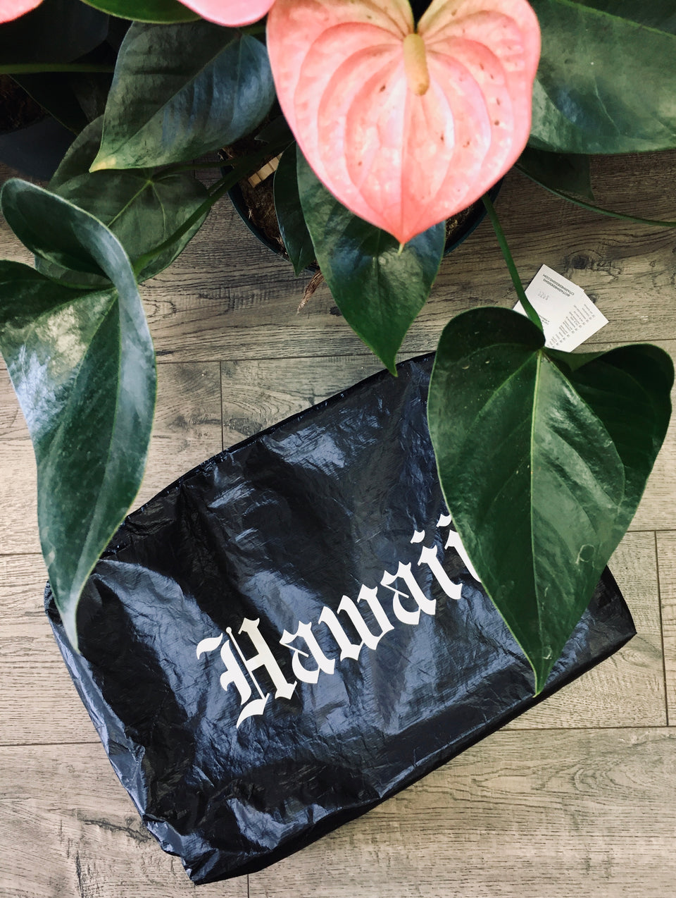 black pouch with hawaii written on it