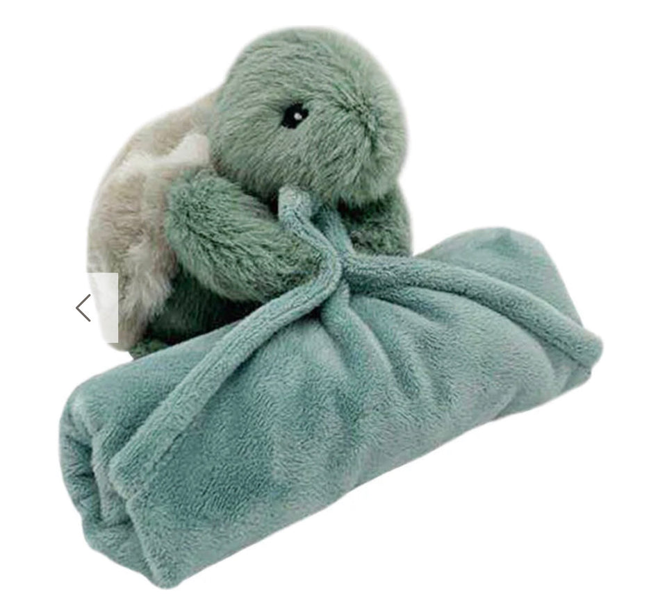 small stuffed turtle attached to small blanket