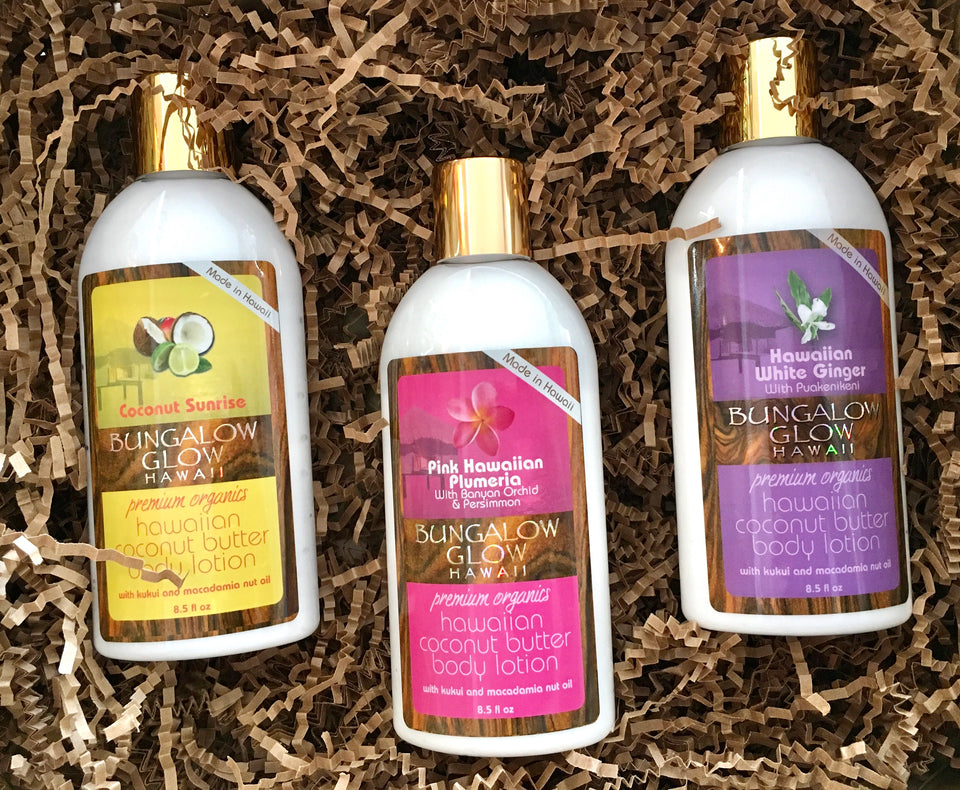 coconut, pink plumeria and white ginger lotion bottles