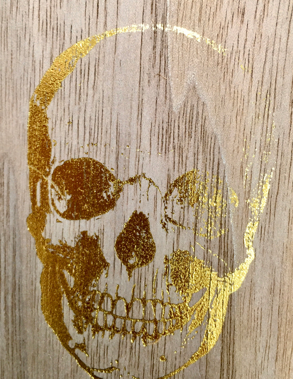 Close up of gold skull design