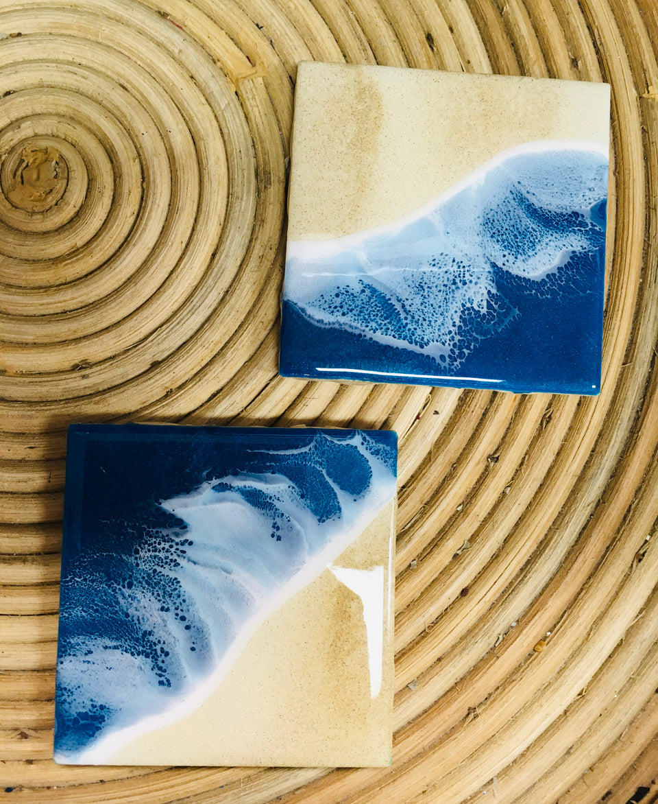 a photo of two blue ocean coasters