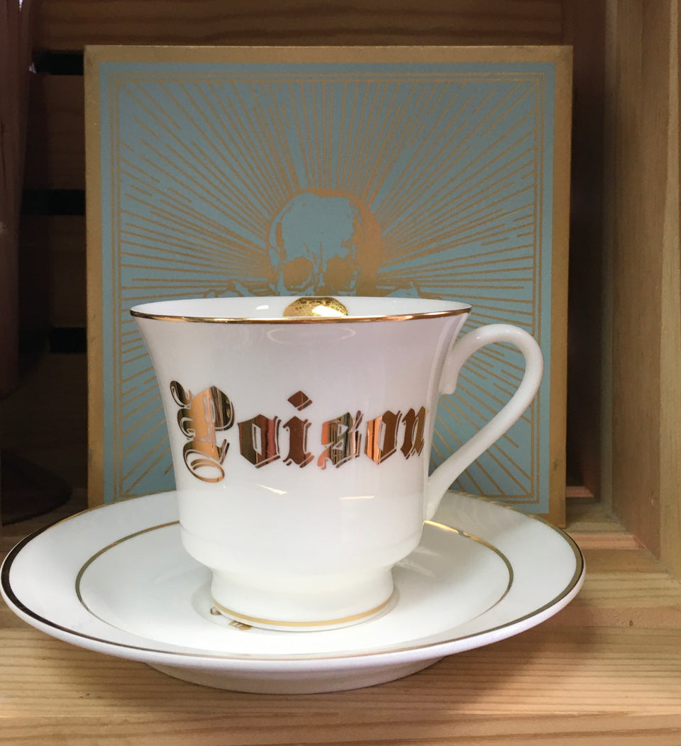 fancy tea cup that says Poison