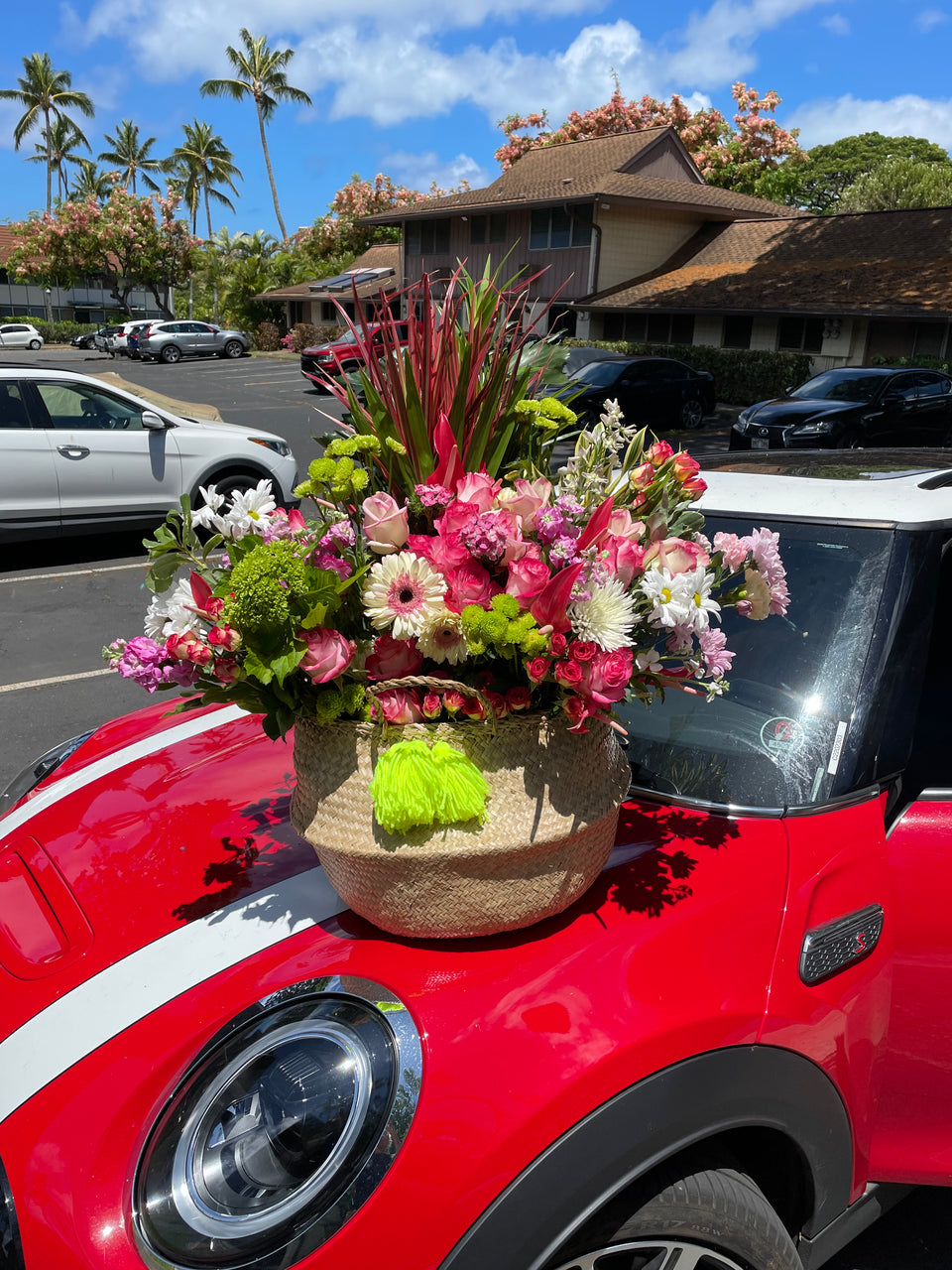 giant flower basket, mixed flowers on a car