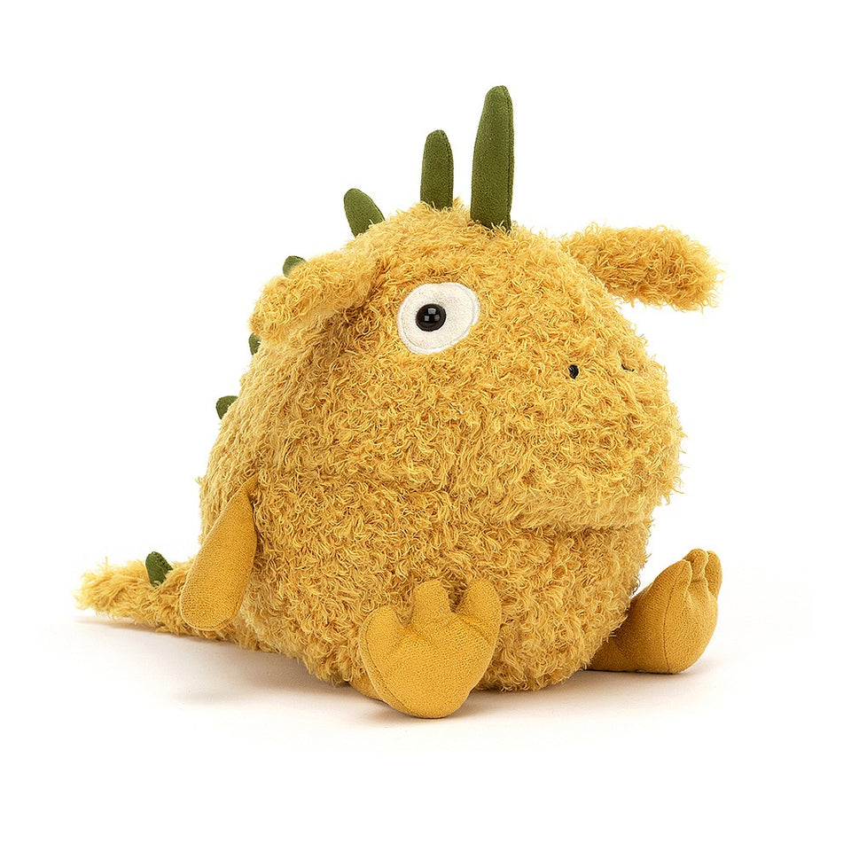 chubby happy yellow stuffed monster with green horns