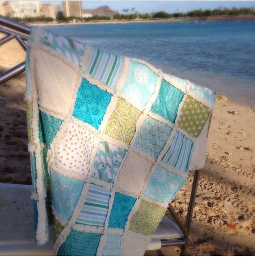 patchwork quilt in blues and greens