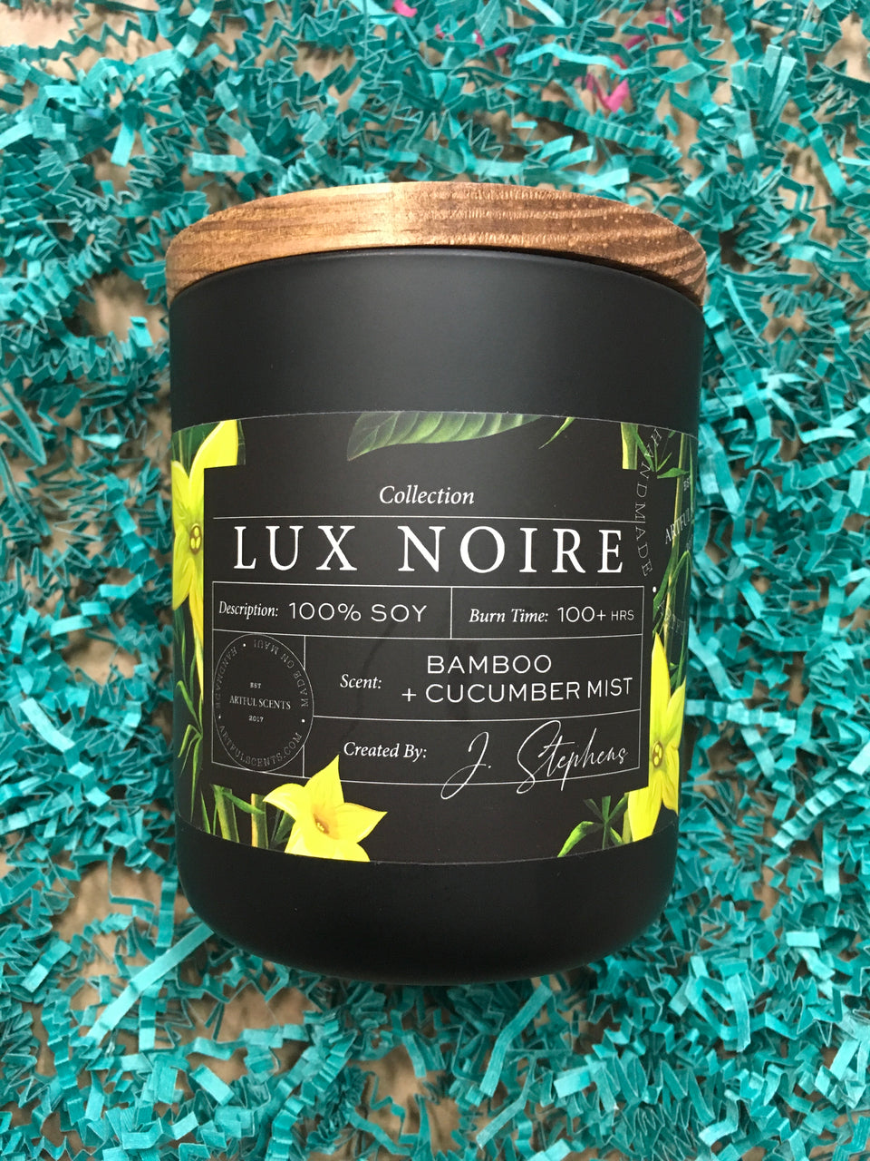 CLose up of Lux Noir Candle black glass and wooden top