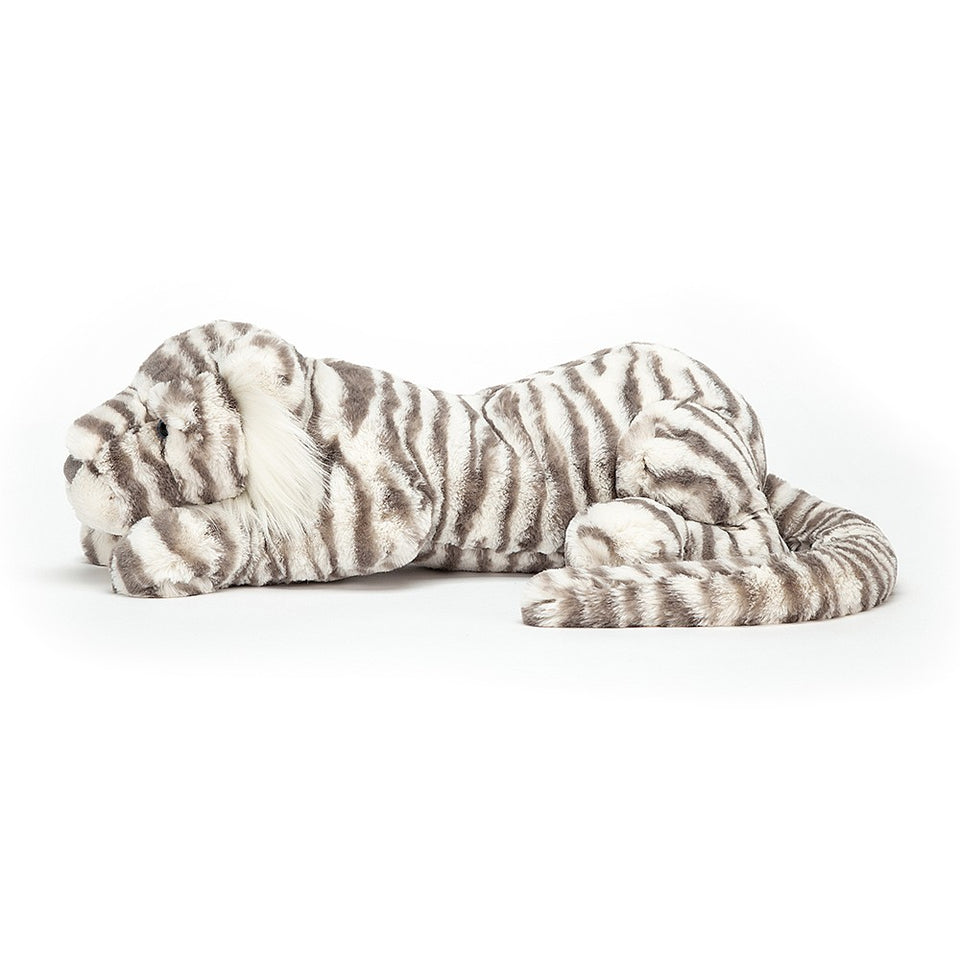side view white stuffed snow tiger laying down
