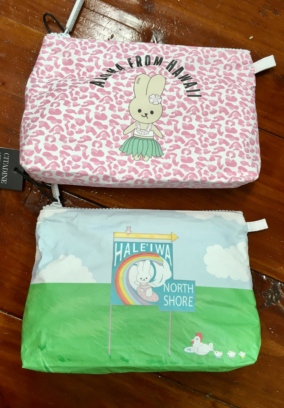 Pouch with bunny and hula skirt, second pouch with haleiwa sign and bunny