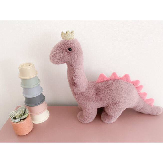 pink stuffed dinosaur with a green crown