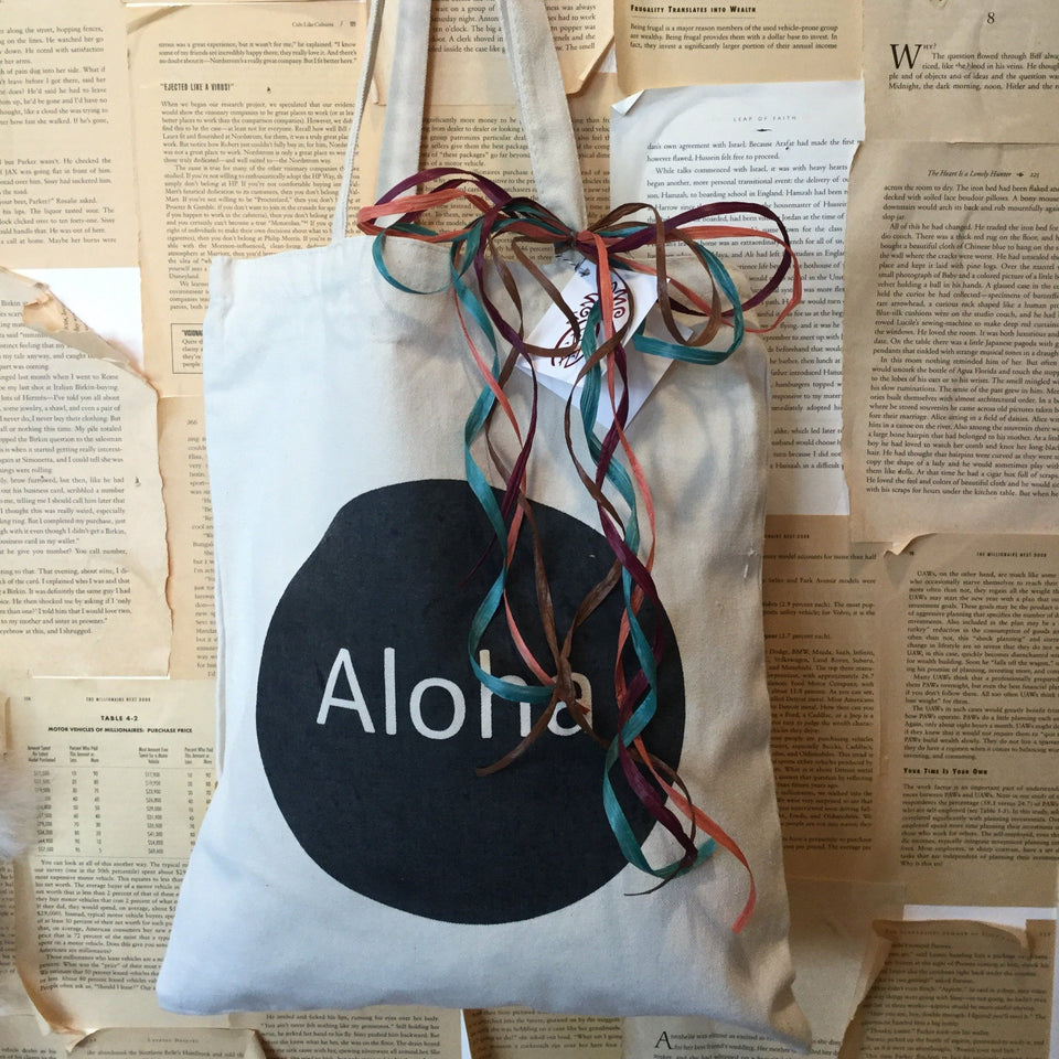 tote bag black circle with aloha written on the front