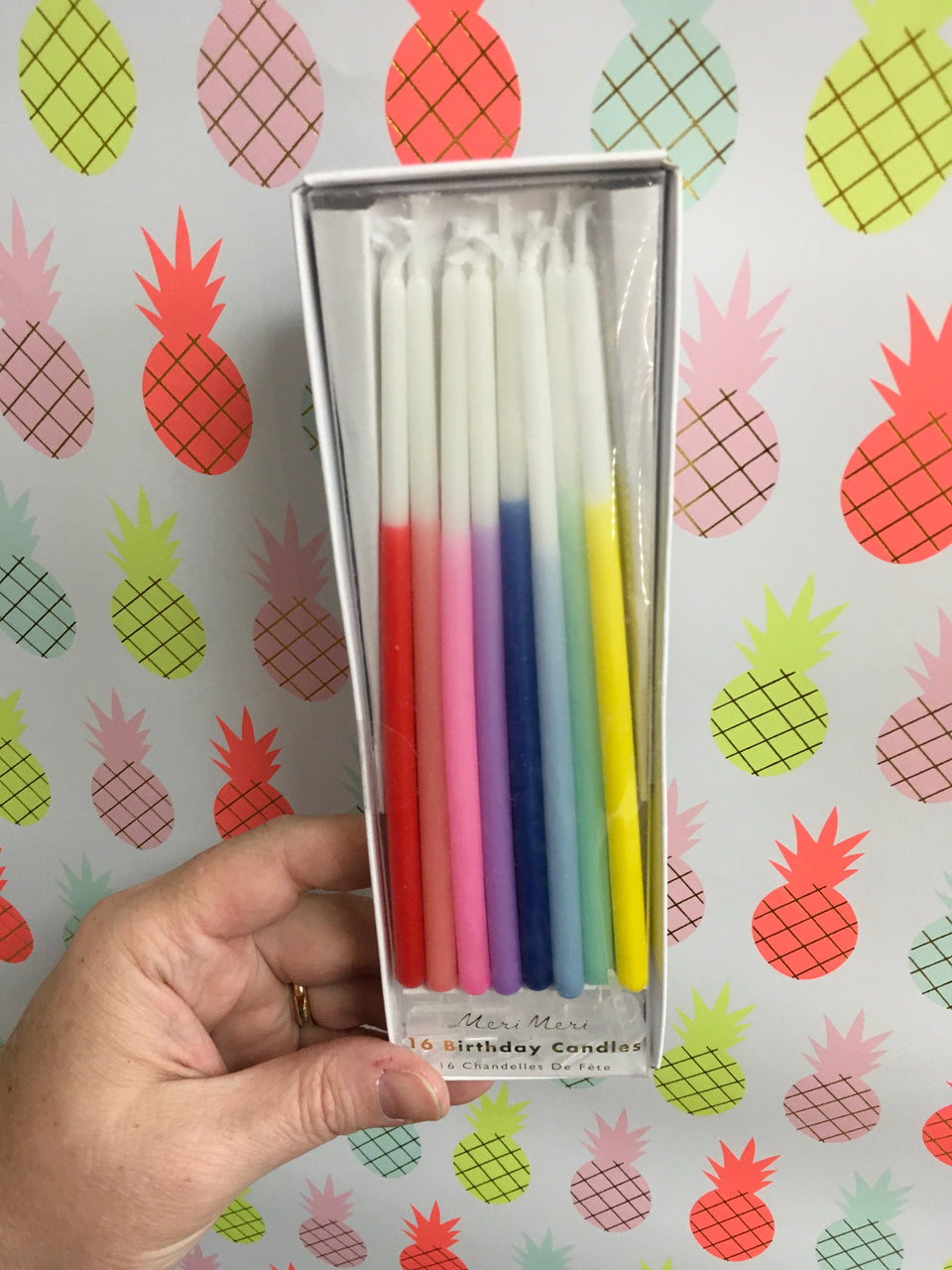 Box of various shades of bold colors extra long candles