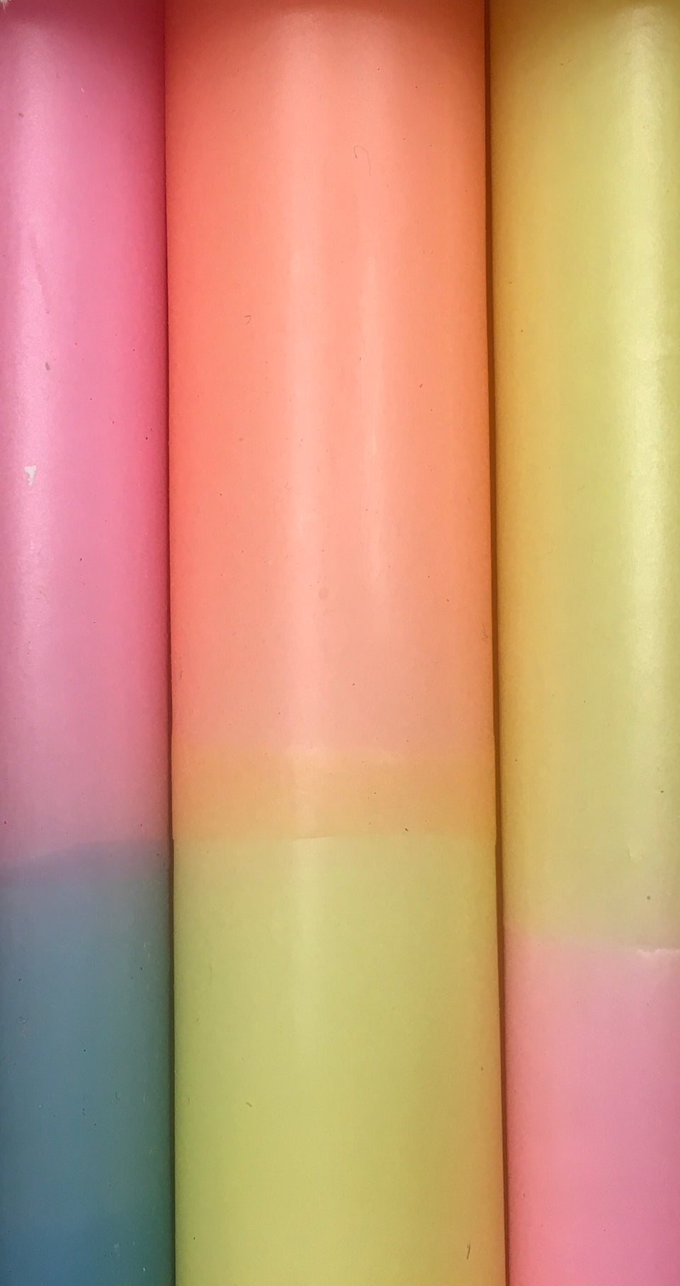 close up of rainbow candles 