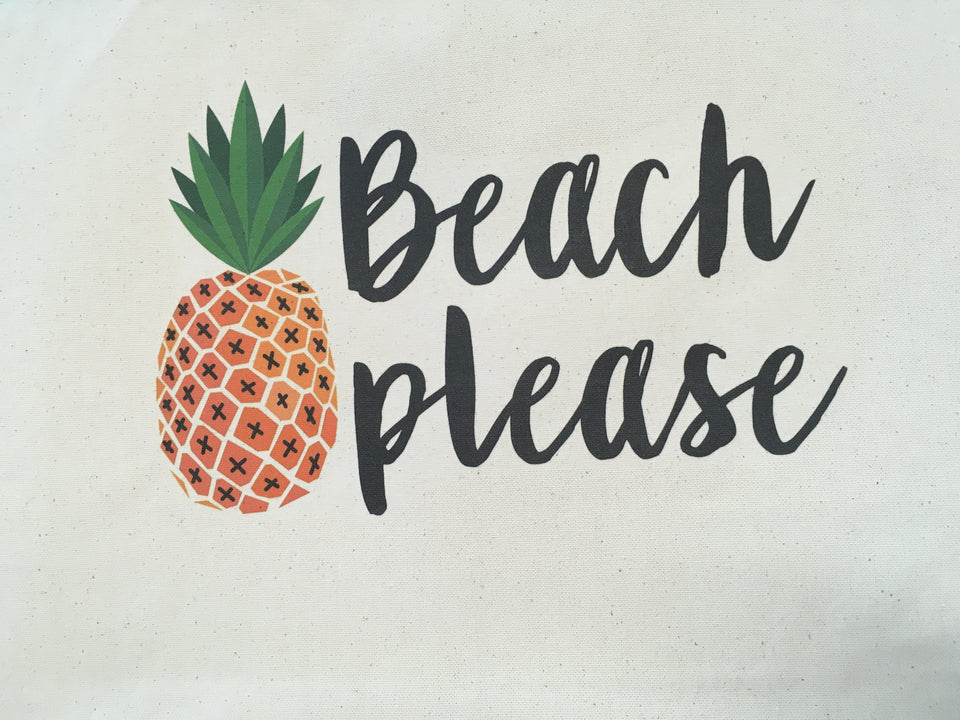 Large canvas bag with pineapple graphic and beach please written in black font.