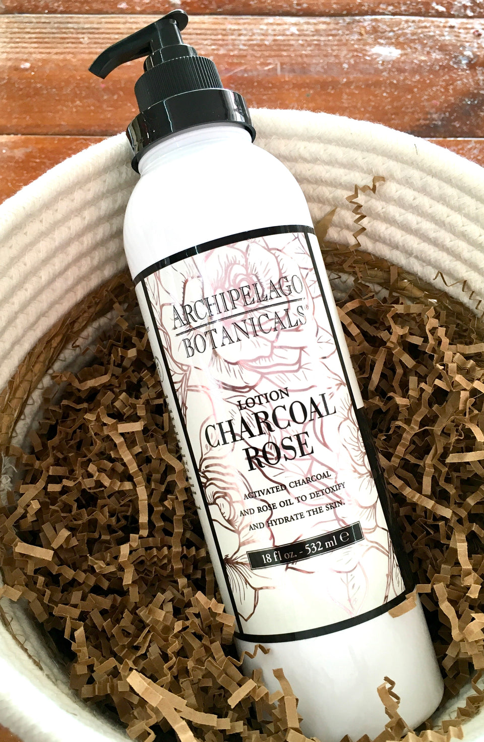 Bottle of Charcoal Rose Lotion.